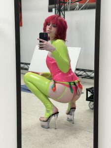 Kinky teen TS Ella Hollywood with red hair and neon latex