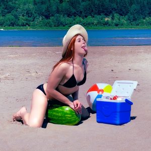 Redhead TS Shiri Trap fucking a watermelon at the beach