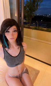 Tiny TS in sports bra on her knees