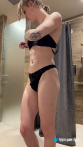Paige Wright putting on bra and panties